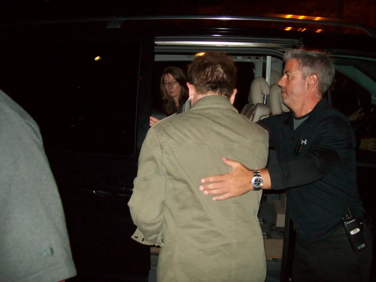 Bono of U2 entering a chauffeur-driven vehicle in Istanbul with close protection and guest movement coordination